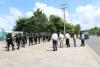 Police officers gather outside an industrial park in Dong Nai Province to beef up security following riots